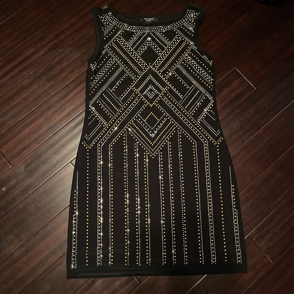 White house black market dress. Black with gold and silver sparkles.